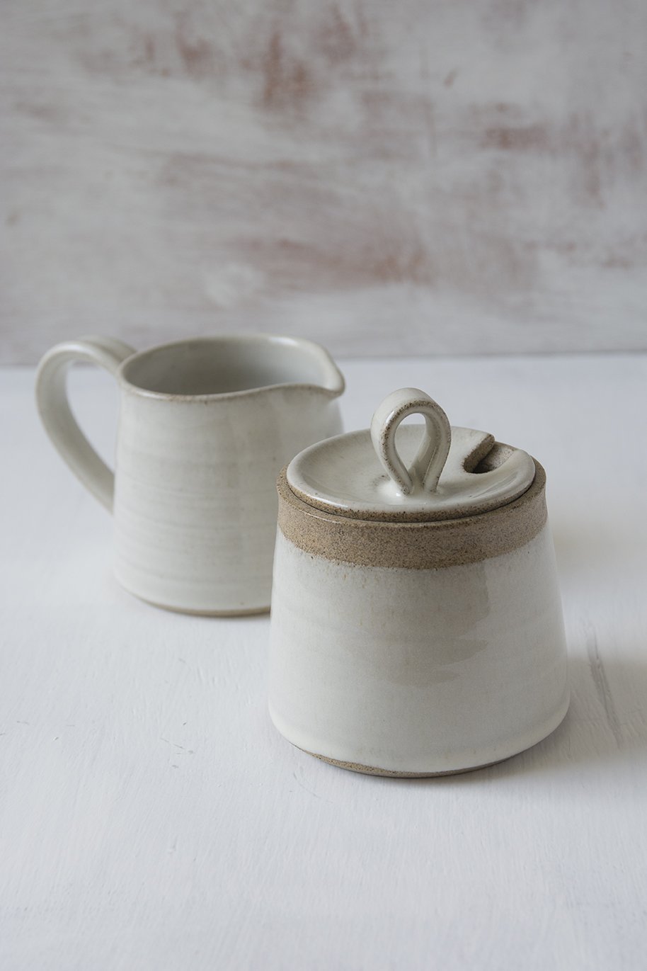http://www.madaboutpottery.com/cdn/shop/products/white-pottery-sugar-bowl-and-creamer-set-613293.jpg?v=1568380607