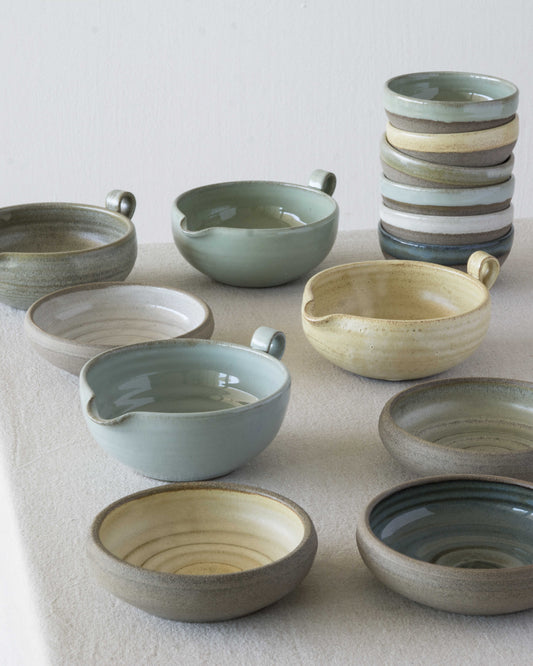 colorful handmade pottery bowls in rustic style