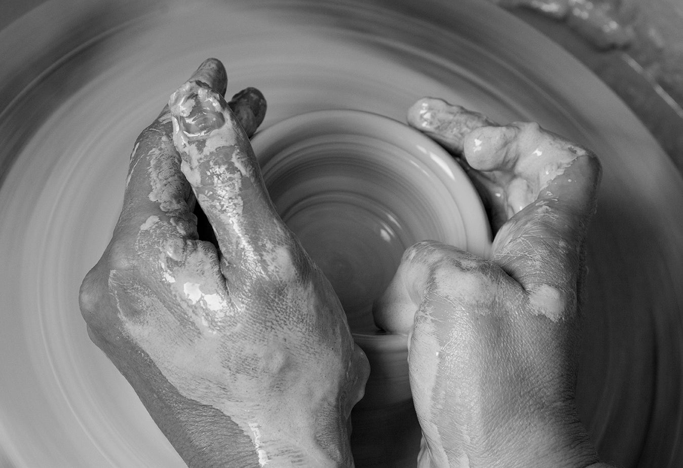 hands on a potters wheel working