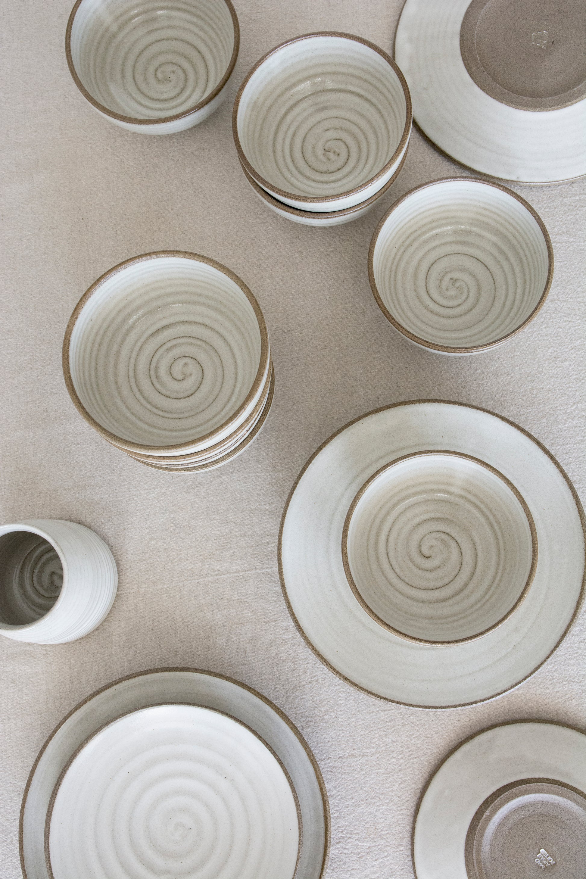 Elegant handmade ceramic bowl with modern farmhouse style, glazed interior and exposed edge.