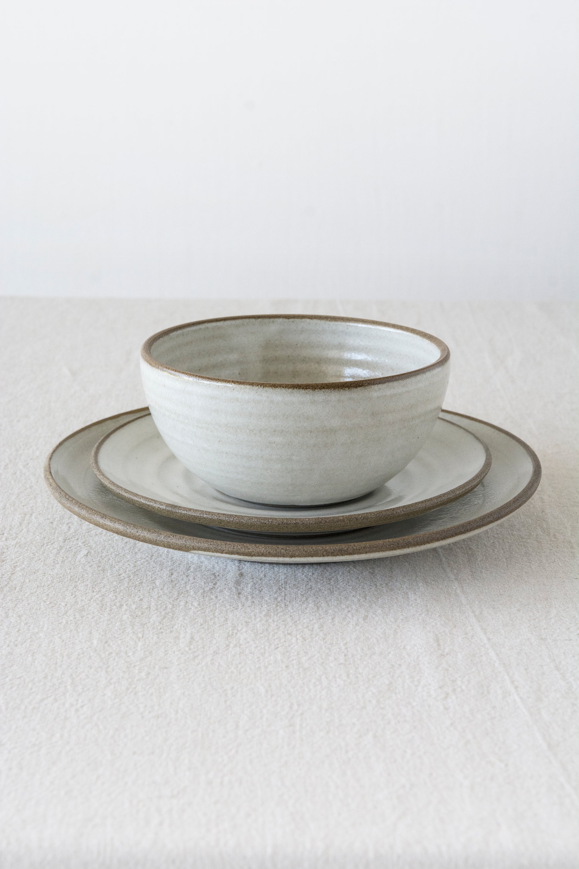 Wheel-thrown pottery bowl, durable stoneware with rustic charm and organic details.