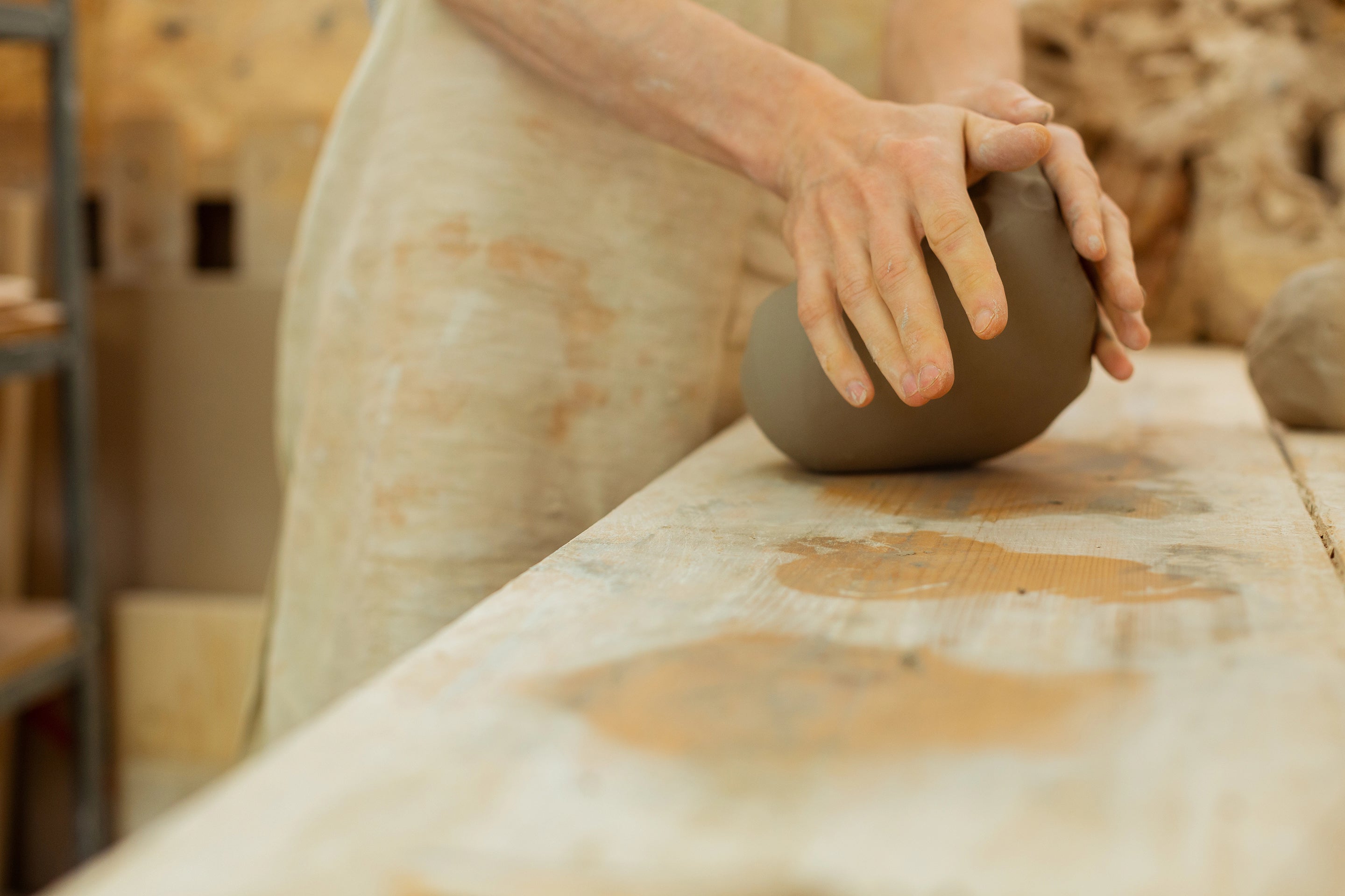 Load video: Potter handcrafting a ceramic cup on the wheel at Mad About Pottery studio – handmade pottery process.