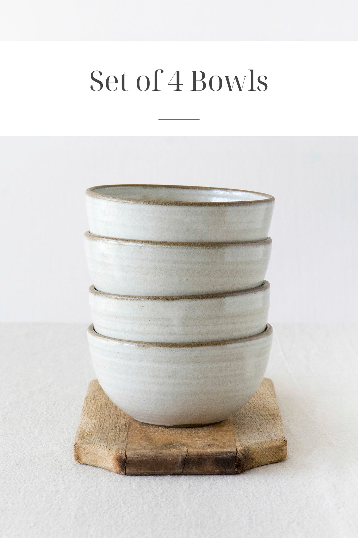 set of 4 white pottery handmade bowls on a white table