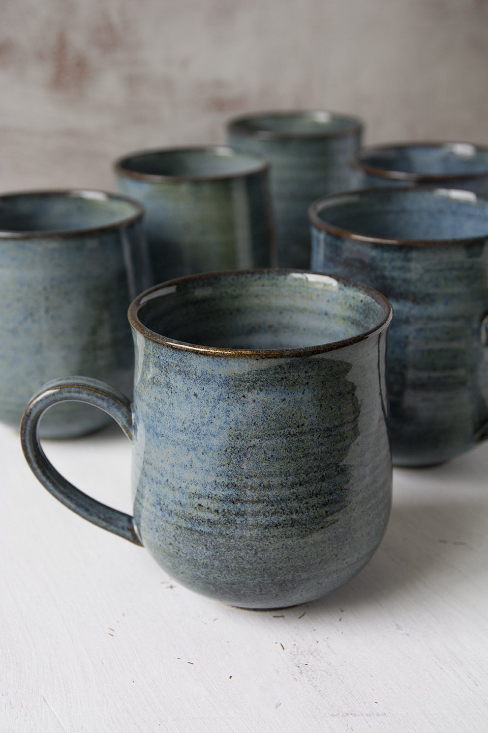 https://www.madaboutpottery.com/cdn/shop/products/blue-pottery-mug-10-fl-oz-898281.jpg?v=1593194917&width=1445