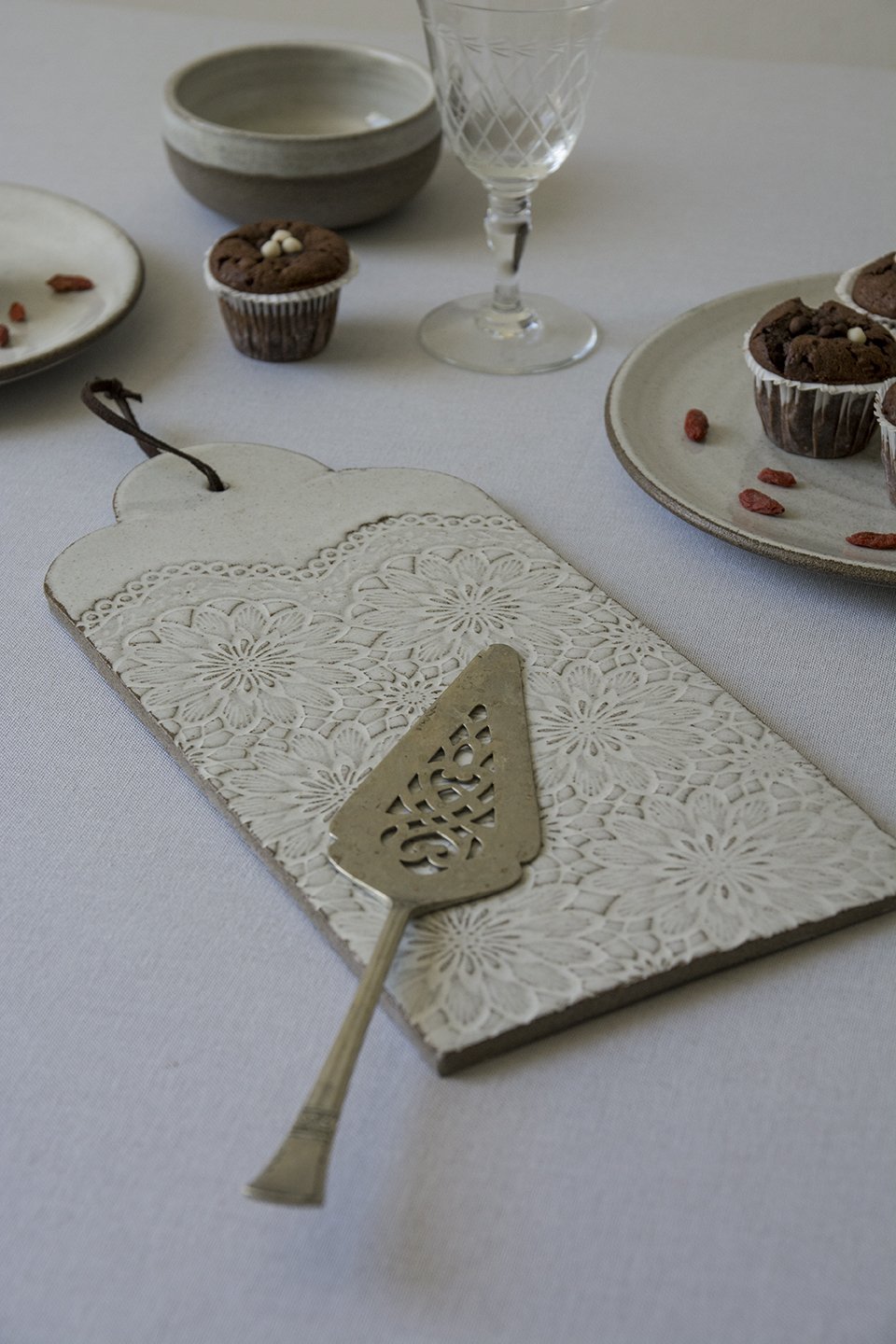 white ceramic carpaccio butter board